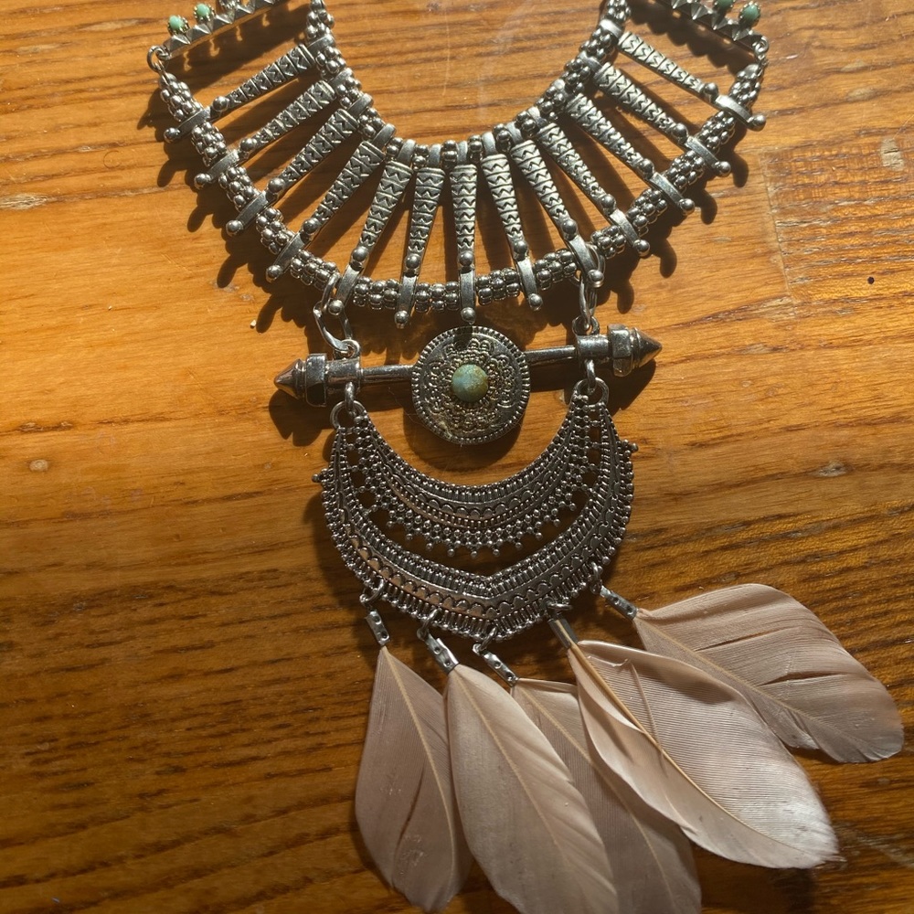 Necklace with intricate embellishments + petals